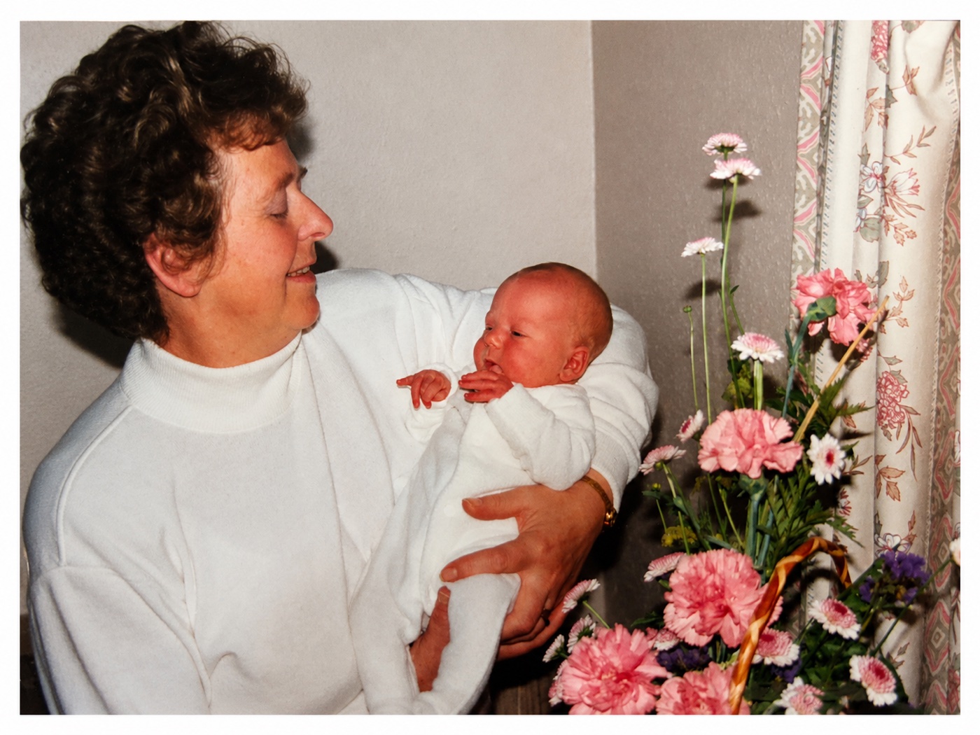 Nana Jean holding her newborn grandchild